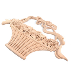 Wood carved ornament in the shape of a flower basket