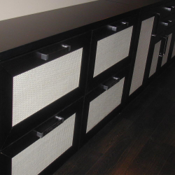 The light-coloured rattan webbing door inserts look great on the black cabinet. The cane webbing is easy to work with.