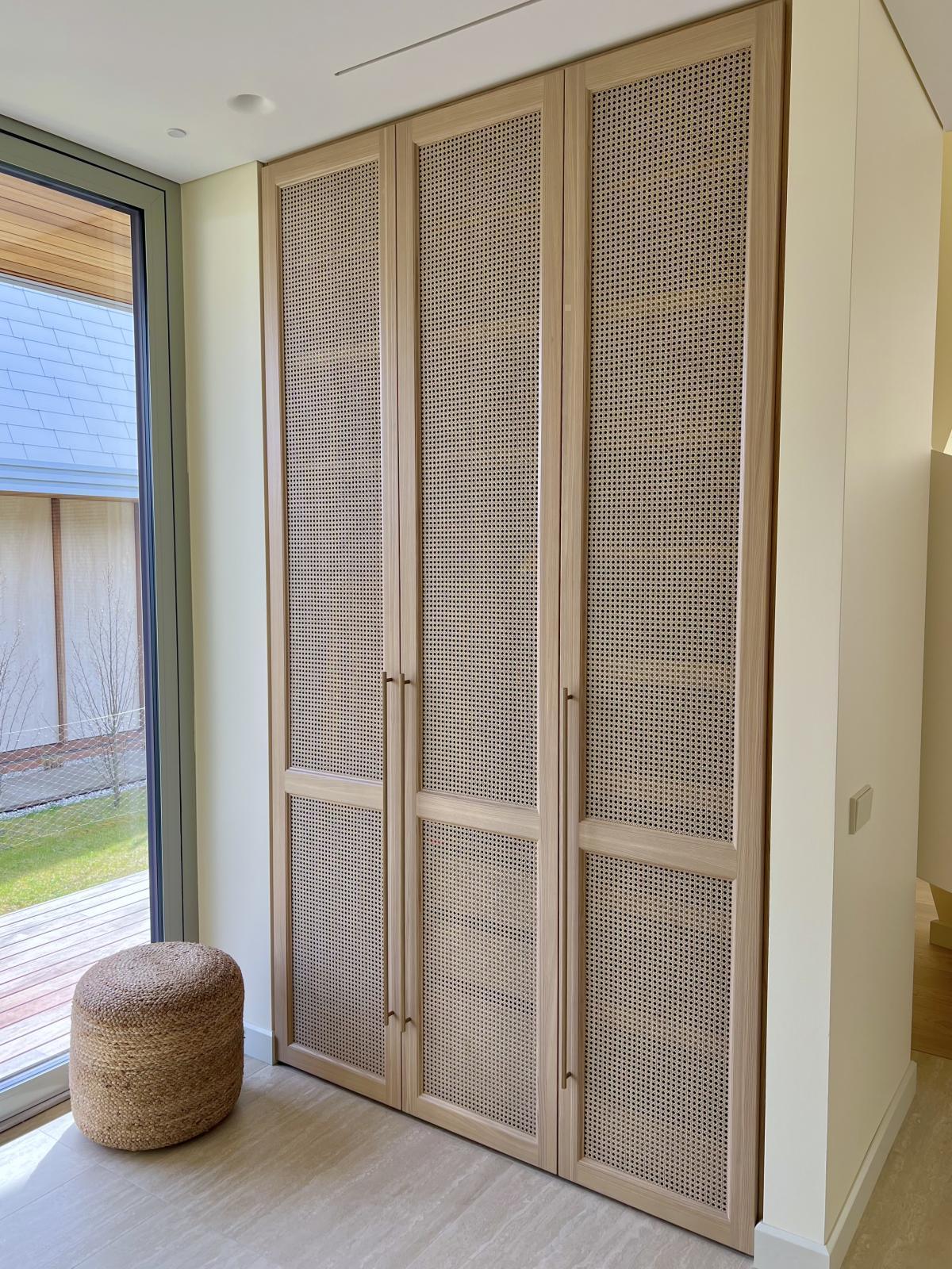 Built-in wardrobe with breathable rattan cane inserts. Shop premium cane webbing rolls for wardrobe doors and decorative radiator covers.